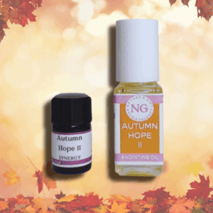Autumn Hope in a 4ml roller bottle and a 2ml coblt glass with leaves background golden