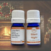 bottles of silent night synergy in front of a raring fire in a cabin decorated with christmas wreats at night
